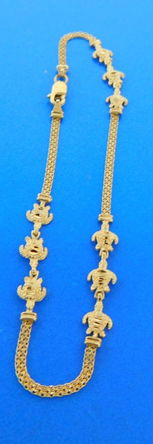 3 sections of 3 sea turtles 1.25'' x .25'' separated with sections of 14k yellow gold bismark chain 10'' long 14k yellow gold